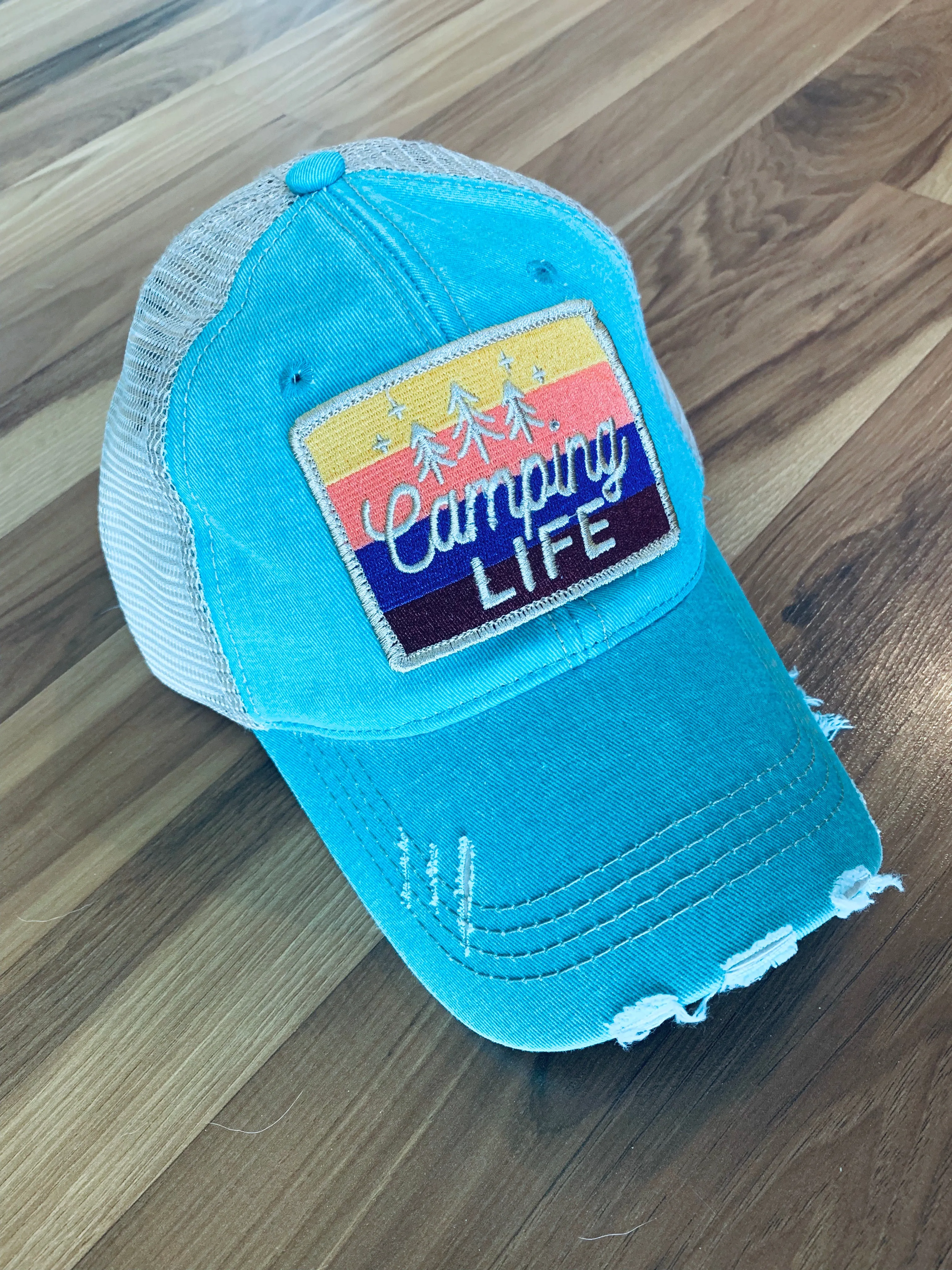 Hats or tanks { I'M A HAPPY CAMPER } { Camping hair don’t care } { Camping life } { Glamping hair don’t care } Embroidered distressed gray unisex trucker caps. Adjustable Velcro and hole for pony. RV there yet?